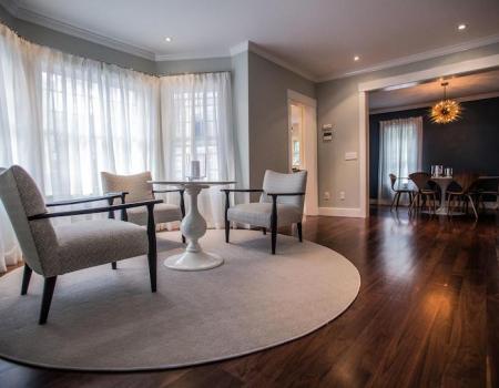 living room with wood floor, circle rug and modern furniture at 27 union street