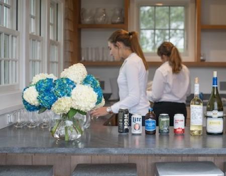 two female staff at an event party at a nantucket vacation rental 