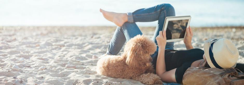 woman on beach with dog