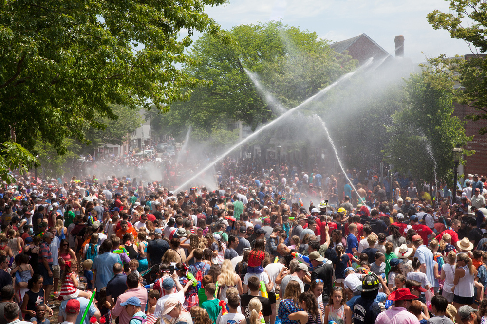 hazlegrove view of tons of people with water hoses shooting water everywhere