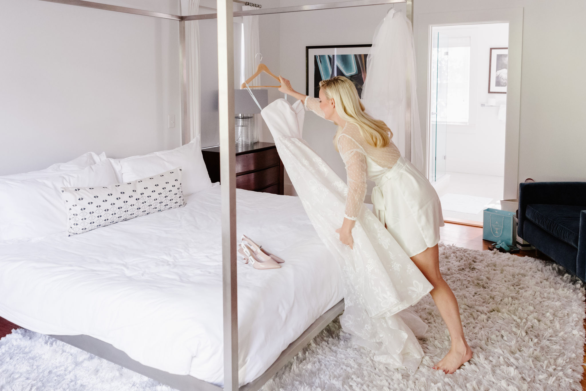 girl with wedding dress in bedroom all in white at nantucket vacation rental